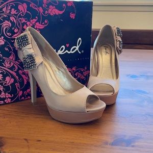 Wore once for a wedding. Gently used, slip on.